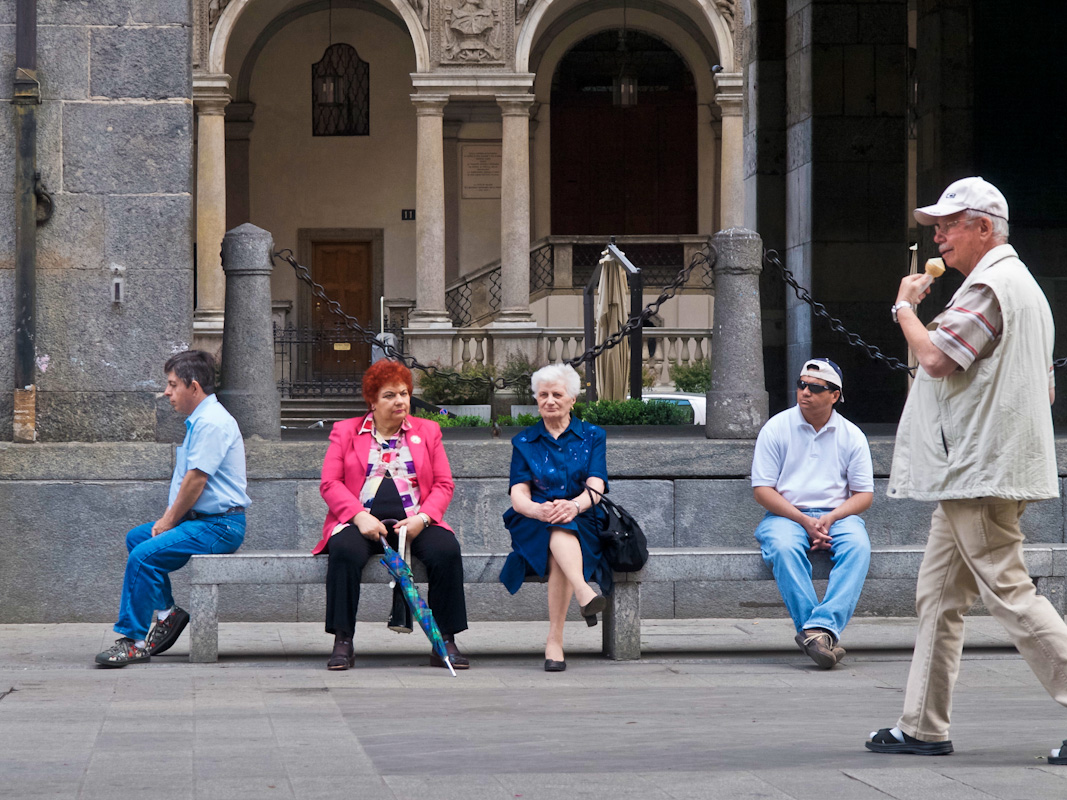 People on bench, Milan, Italy.